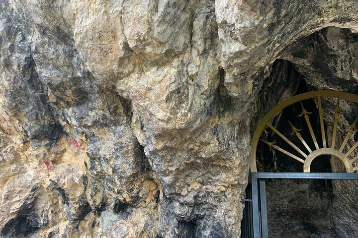 Rock entrance to the sacred cave at the Lac sanctuary