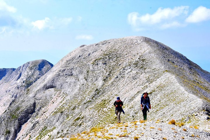 Reaching the peak (2417m) of Tomor Mountain