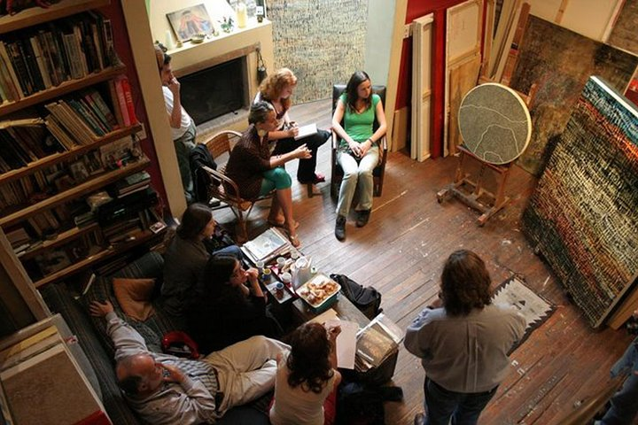 Patrons enjoying an intimate talk with an artist