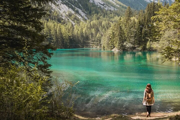 Experience the serene beauty of Green Lake surrounded by lush forests and majestic mountains while enjoying a local meal that highlights Austrian culinary traditions. Perfect for nature lovers.