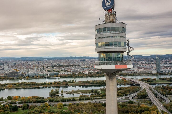 Experience breathtaking views from Austria's tallest landmark where the Danube River winds through stunning landscapes offering an unforgettable perspective of Vienna’s beauty from 150 meters above.