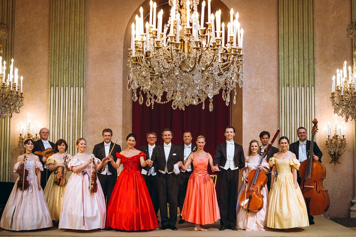 Experience an unforgettable evening of timeless music as the Vienna Residence Orchestra accompanied by opera singers and ballet dancers fills the historic elegance of a Viennese palace with melodic charm.