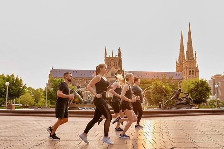 Explore Sydney’s scenic routes on foot jogging past iconic landmarks like the Royal Botanic Gardens and Darling Harbour while soaking in the morning sun and local insights.