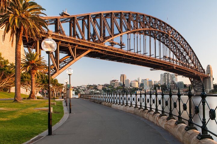 Discover stunning views as you stroll along the waterfront with the iconic Sydney Harbour Bridge towering above perfect for enjoying the delightful tastes of the city's diverse culinary scene.
