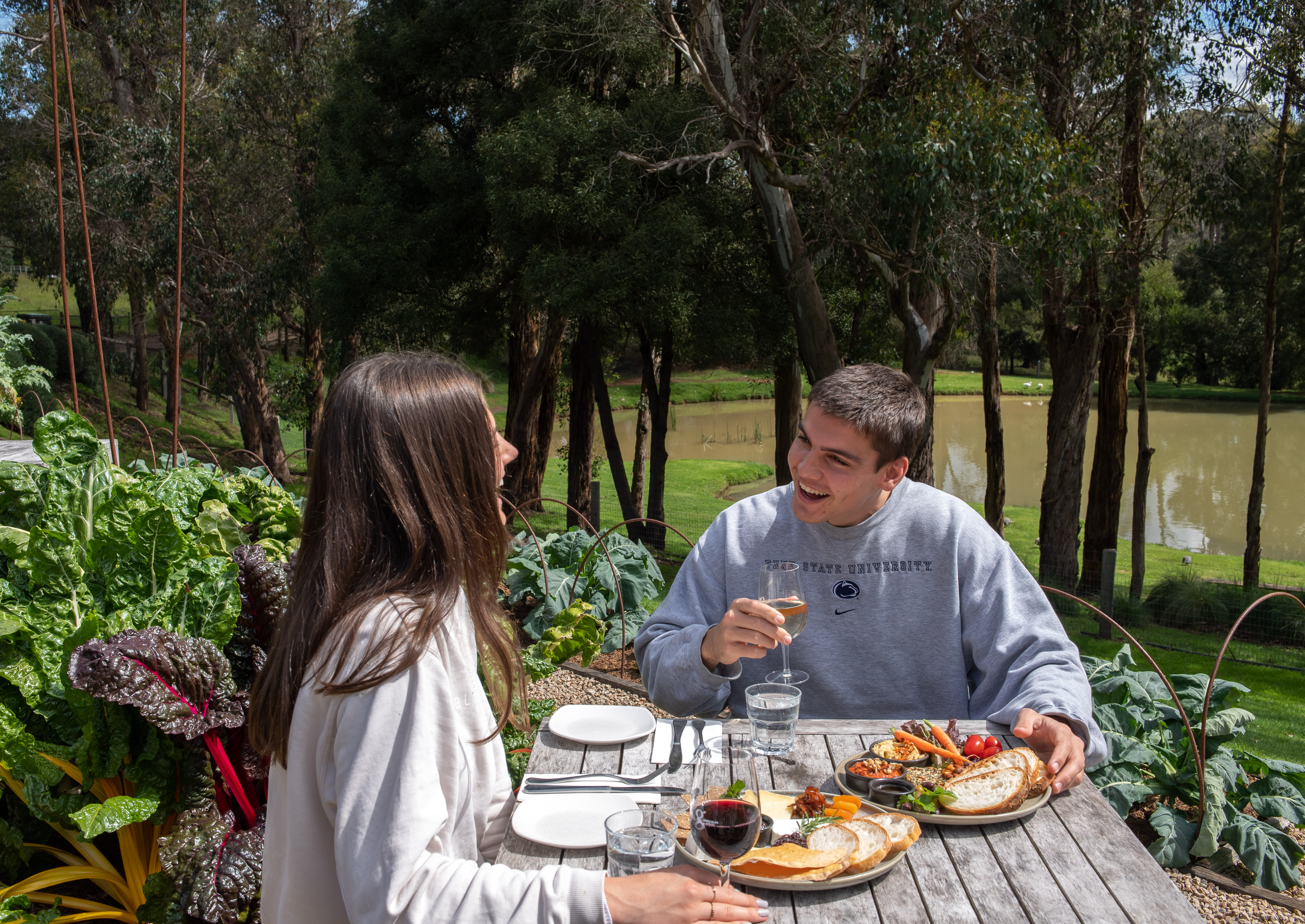 Savor a delightful farmer's lunch amidst stunning vineyard views enjoying fresh produce and fine wine creating lasting memories in the serene setting of Mornington Peninsula.