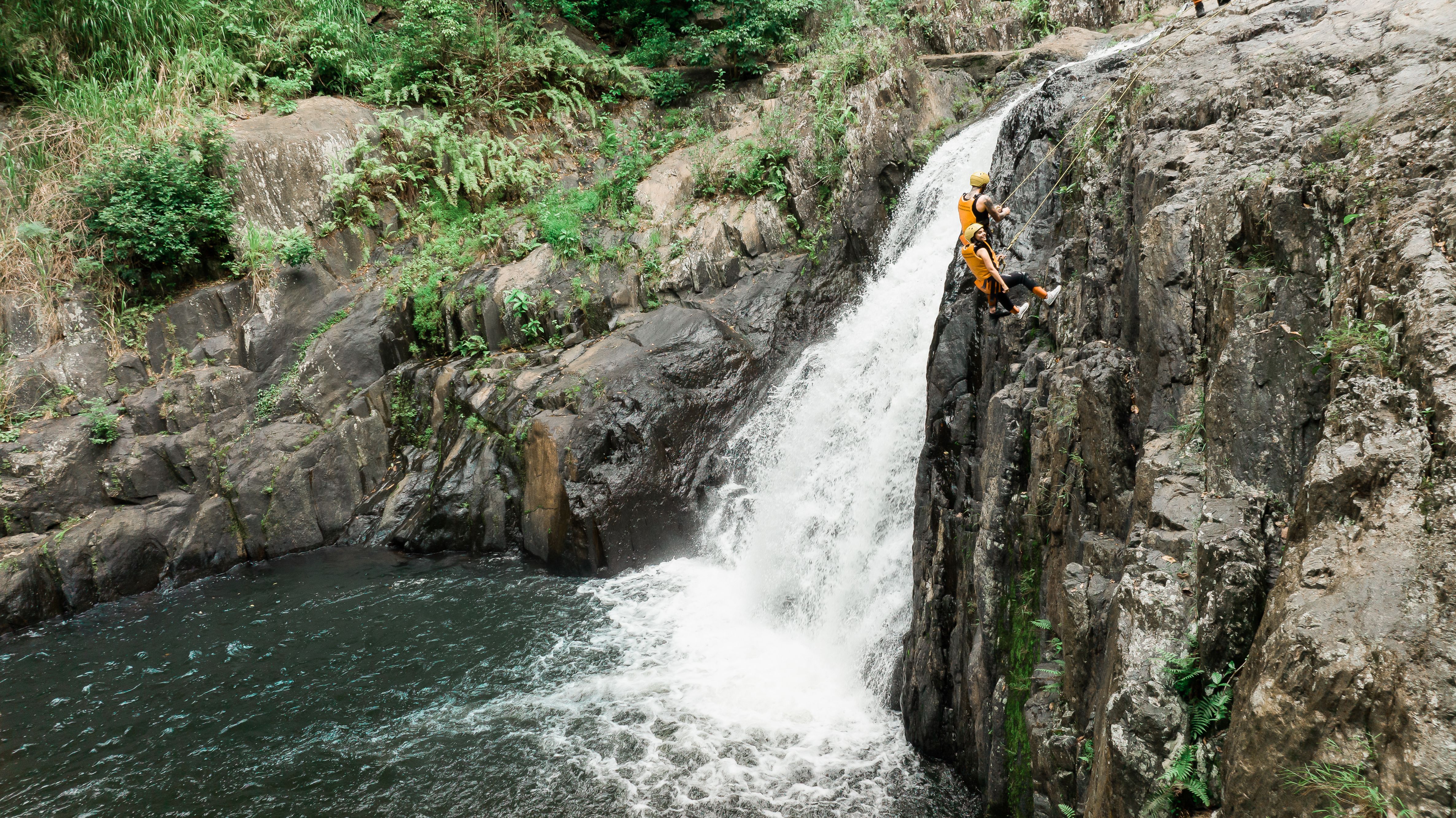 Experience the natural wonder of Behana Gorge as you abseil down stunning waterfalls with expert guides ensuring a safe yet adventurous journey tailored to your skill level.