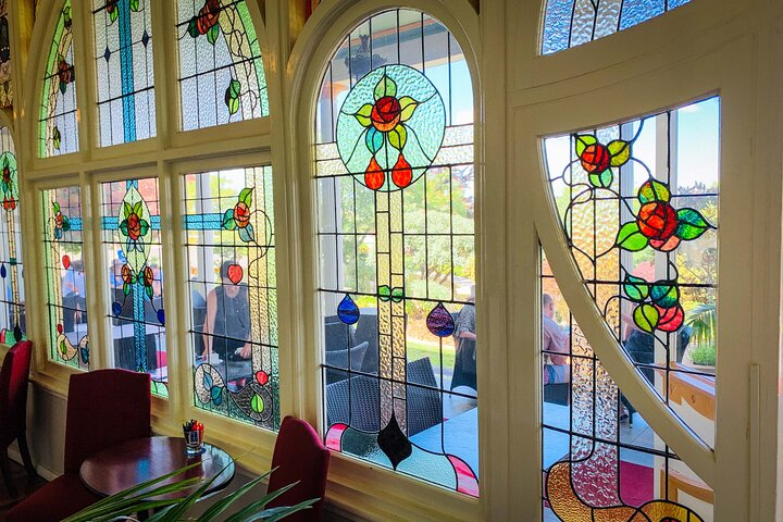 Experience the charm of the Blue Mountains as sunlight filters through stained glass creating a unique ambiance for relaxation and exploration among breathtaking scenery and local delights.