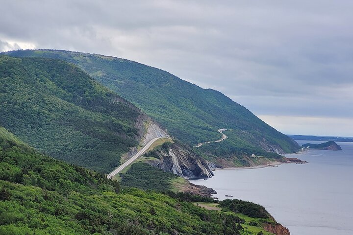 Breathtaking views of the Cabot Trail await featuring winding roads lush landscapes and stunning coastal scenery perfect for travelers seeking adventure and natural beauty. Discover hidden gems along the way!