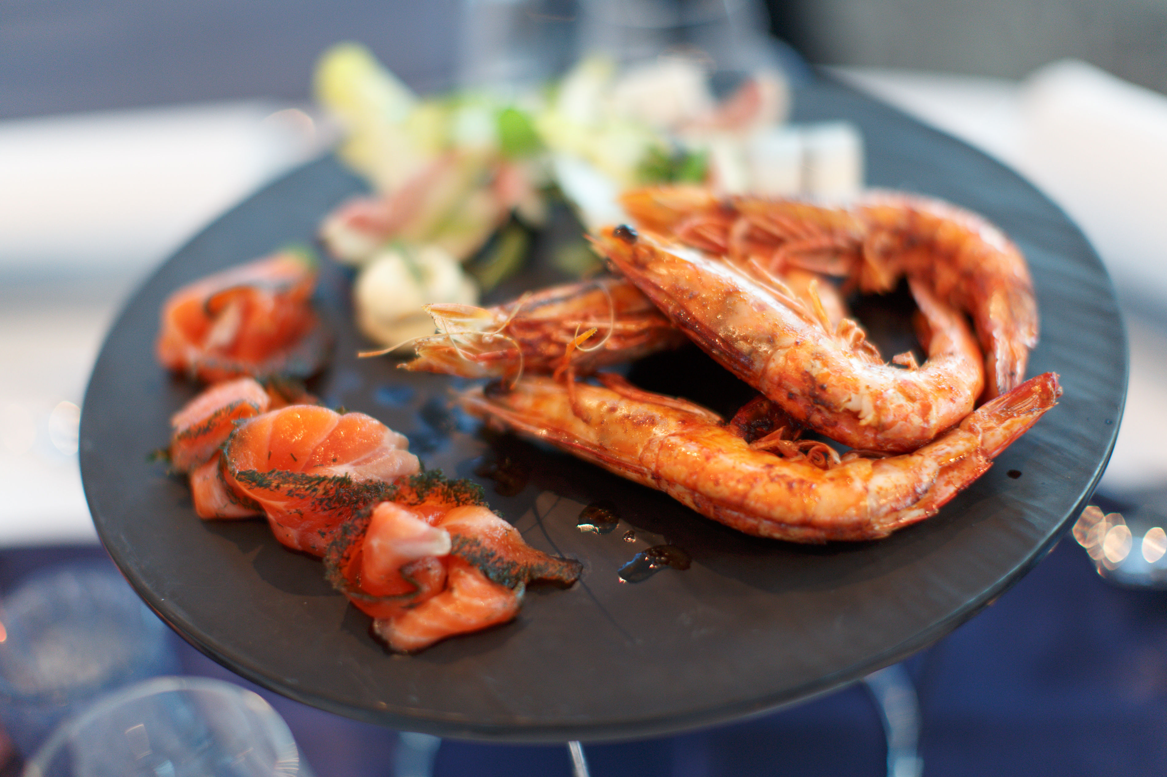 Savor exquisite seafood while cruising the stunning Sydney Harbour enjoying panoramic views from a sleek glass boat. Experience fine dining and refreshing drinks in a unique setting.