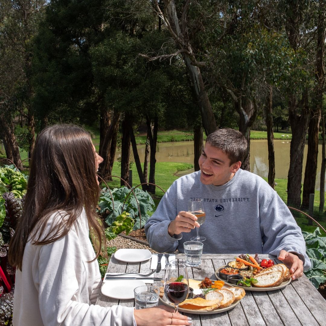Savor a delightful farmers' lunch amid lush landscapes enjoying fresh local flavors and a scenic vineyard view perfect for a memorable experience on the Mornington Peninsula.