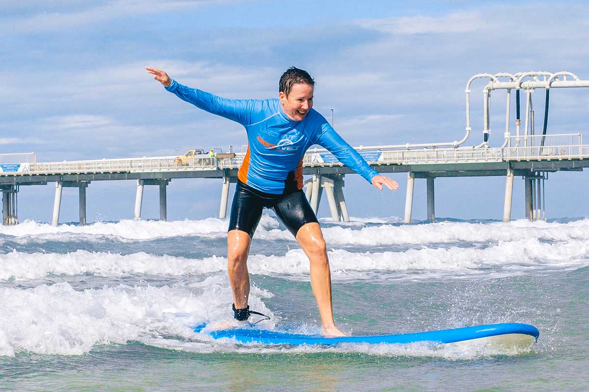 Experience the joy of catching waves in Gold Coast where friendly instructors guide you through standing up on your board surrounded by stunning coastal views and a welcoming beach community.