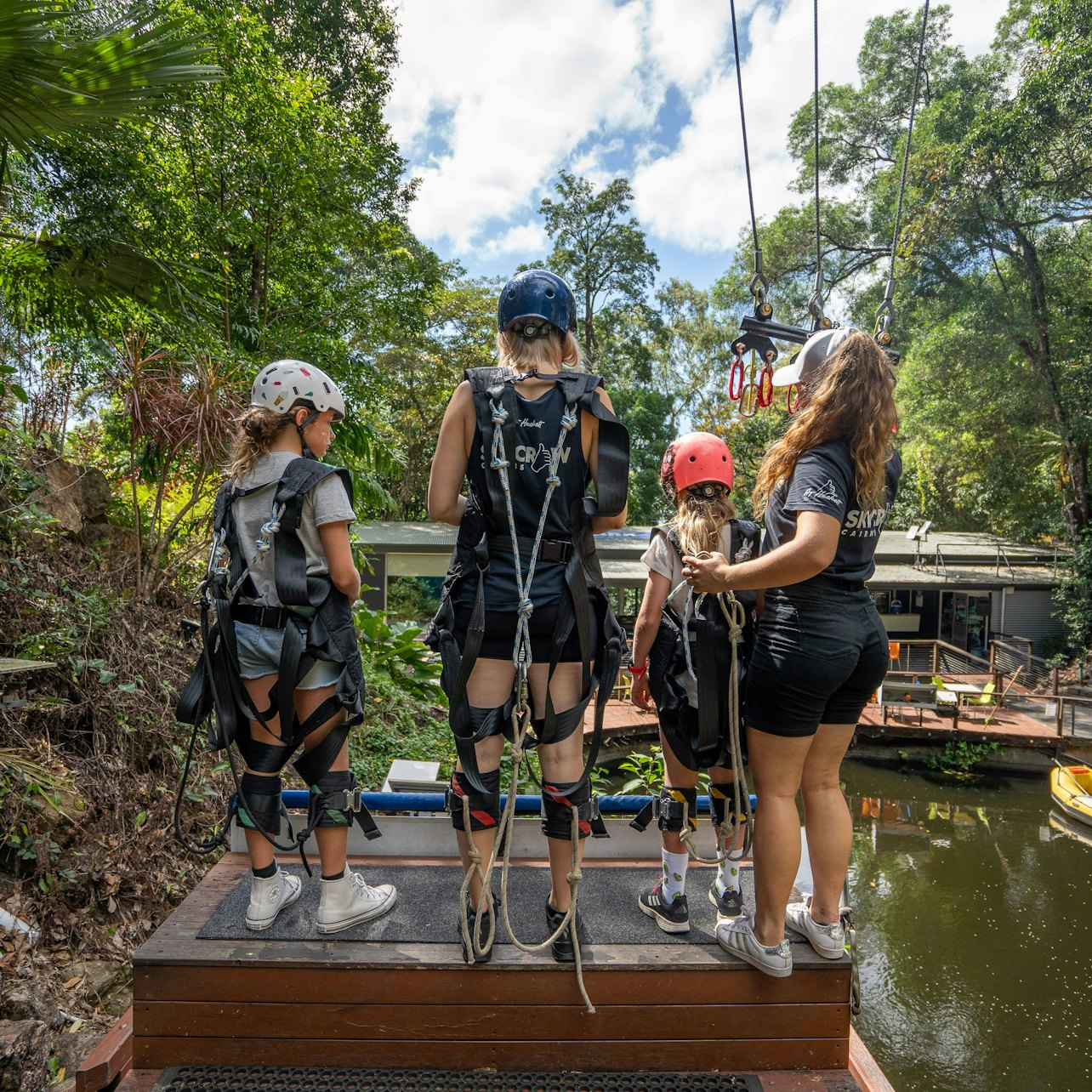 Soar through the lush rainforest canopy on the Giant Swing feeling the rush as you accelerate towards breathtaking heights surrounded by nature's beauty and shared excitement with friends and family.