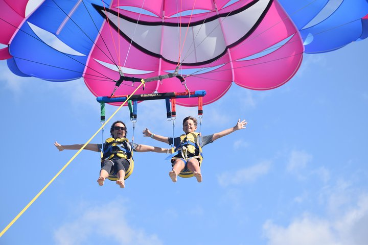 Soar 400ft above the stunning Gold Coast taking in panoramic views while enjoying the rush of parasailing with a friend. An unforgettable adventure awaits in the sky!