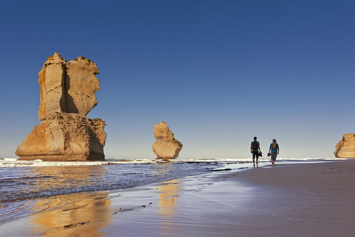 Explore the stunning coastline at the Twelve Apostles where towering rock formations meet golden sands perfect for an intimate walk and unforgettable memories along the Great Ocean Road.