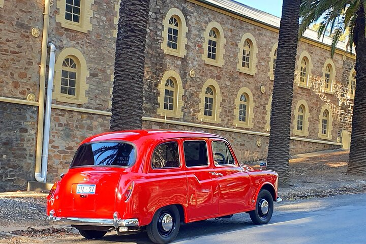A unique experience awaits in the charming Barossa Valley as you explore stunning landscapes in a distinctive Red London Cab perfect for wine enthusiasts and scenic lovers alike.