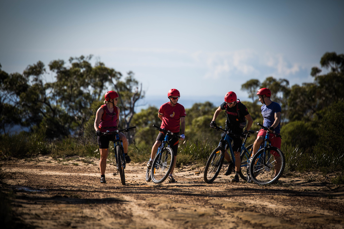Experience the stunning views along Burramoko Ridge while biking or e-biking. Enjoy the raw beauty of Hanging Rock where lush trees and golden cliffs create an unforgettable backdrop.