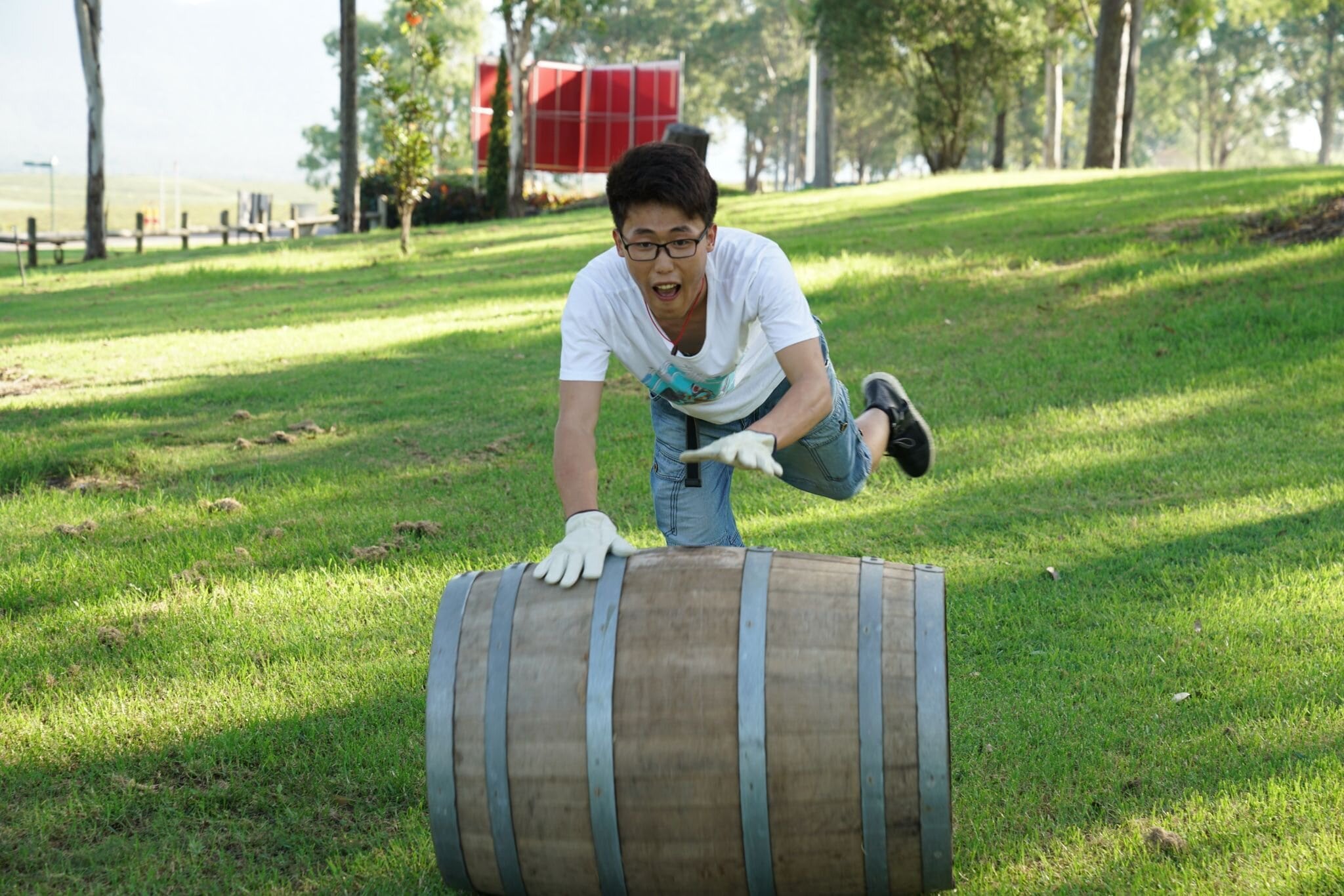 Experience the excitement of barrel rolling at Hunter Valley Resort where teamwork meets laughter in a scenic landscape creating unforgettable memories with friends and family.