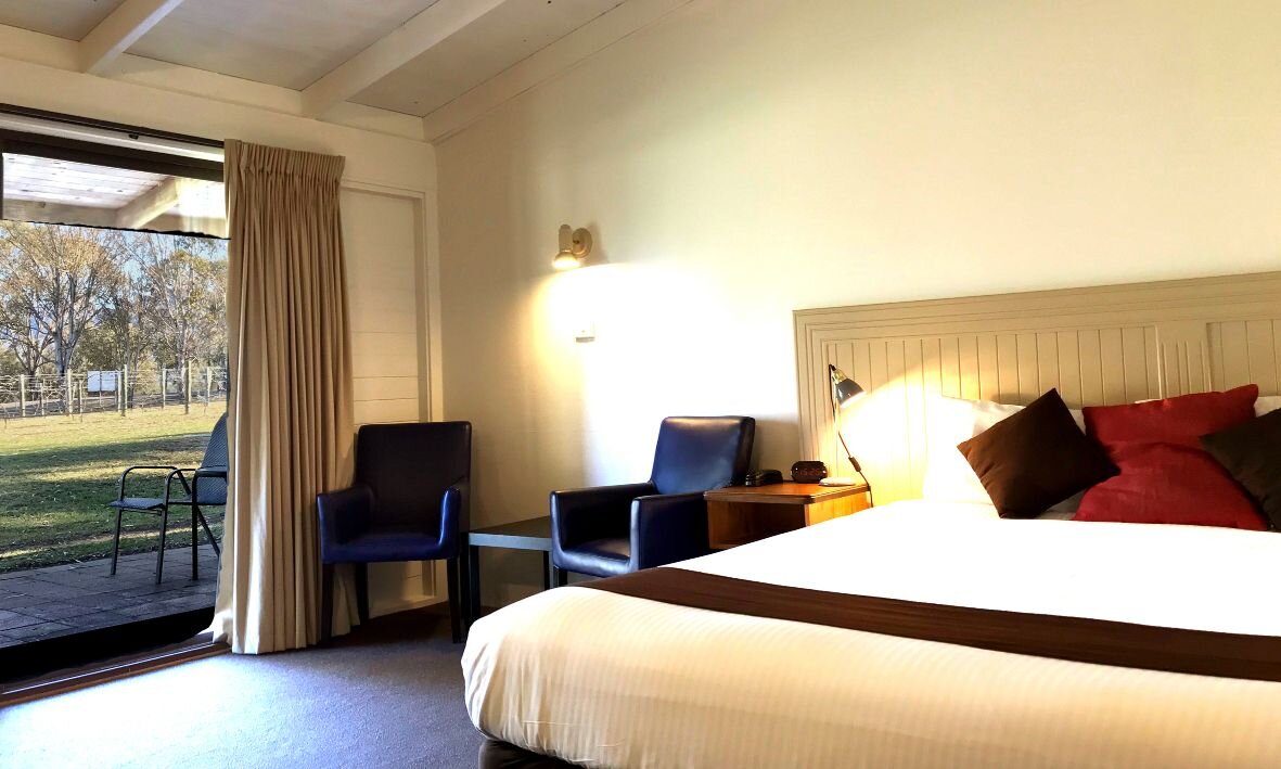 Relax in a cozy room with stunning views of lush grapevines perfect for unwinding after a day of wine tasting in beautiful Hunter Valley. Your peaceful getaway awaits.