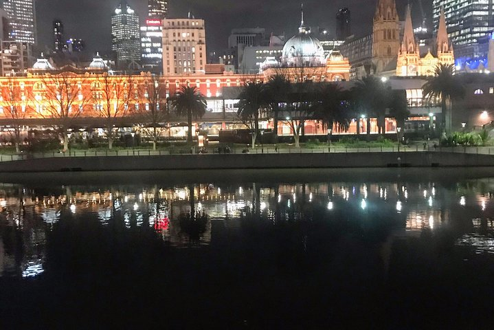 Experience Melbourne's stunning skyline reflected on the Yarra River where floodlit buildings create a magical ambiance that showcases the city's charm after dark. Perfect for nighttime explorers.