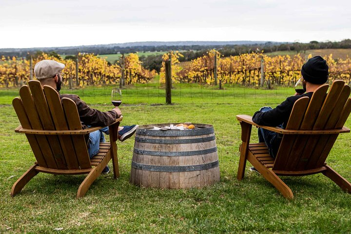 Relax in stylish seating overlooking picturesque vineyards savoring exceptional wines and good company. Discover the joys of local flavors amidst the stunning scenery of the Mornington Peninsula.