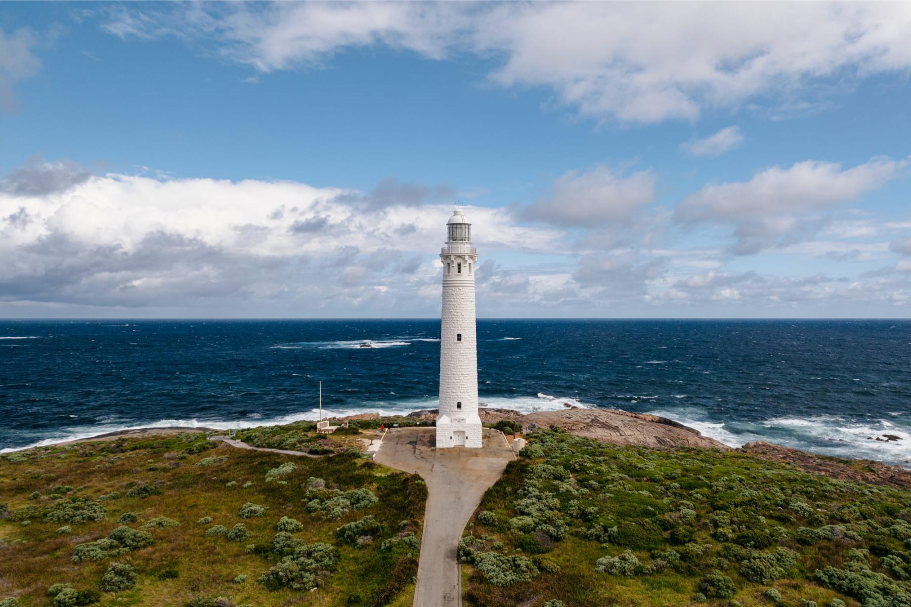 Experience the stunning Leeuwin Lighthouse where two oceans meet surrounded by lush greenery and breathtaking coastal views reflecting the rich history and beauty of Margaret River.