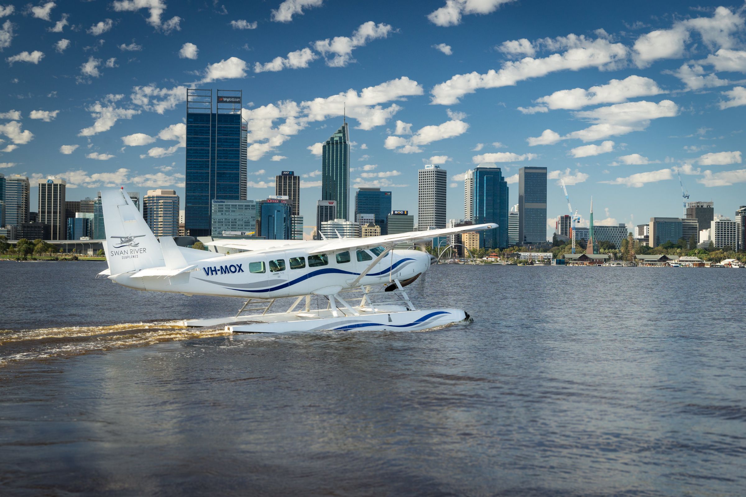 Soar above Perth's skyline and the serene Swan River while enjoying stunning views of iconic landmarks from a seaplane. A unique experience blending cityscape and nature awaits travelers.