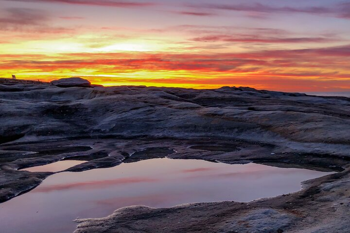 Random rock pool with sunset reflections. 