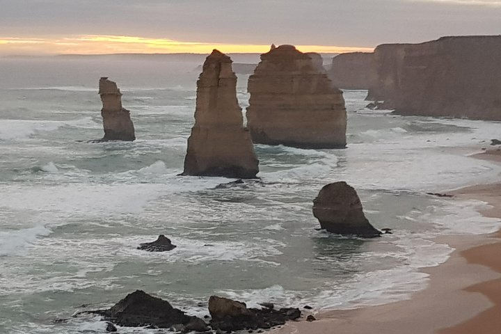 Experience the breathtaking beauty of the 12 Apostles with towering rock formations against stunning coastal vistas showcasing nature’s artistry on your private journey along the Great Ocean Road.