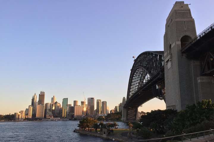Experience Sydney's iconic skyline framed by the Harbour Bridge showcasing the blend of modernity and natural beauty that defines this stunning city. A perfect spot for memorable photos.