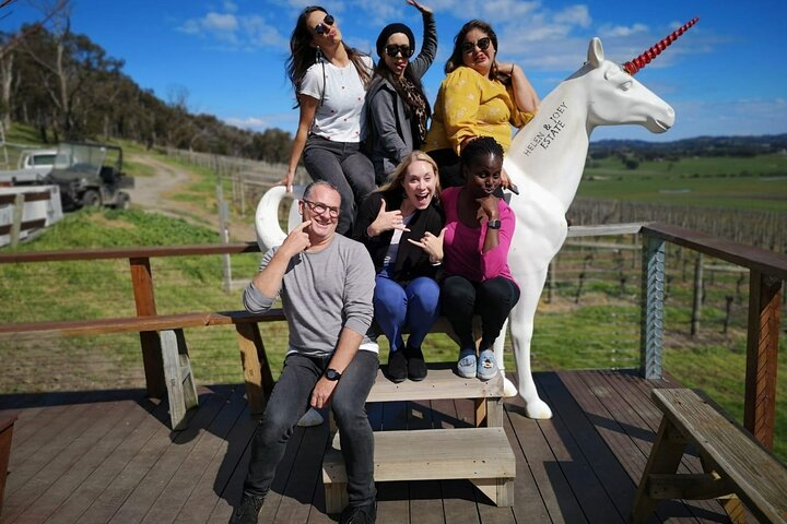 Experience the joy of friendship amidst Yarra Valley’s stunning landscapes celebrating unforgettable moments over wine cheese and chocolate while surrounded by picturesque vineyards and playful charm.
