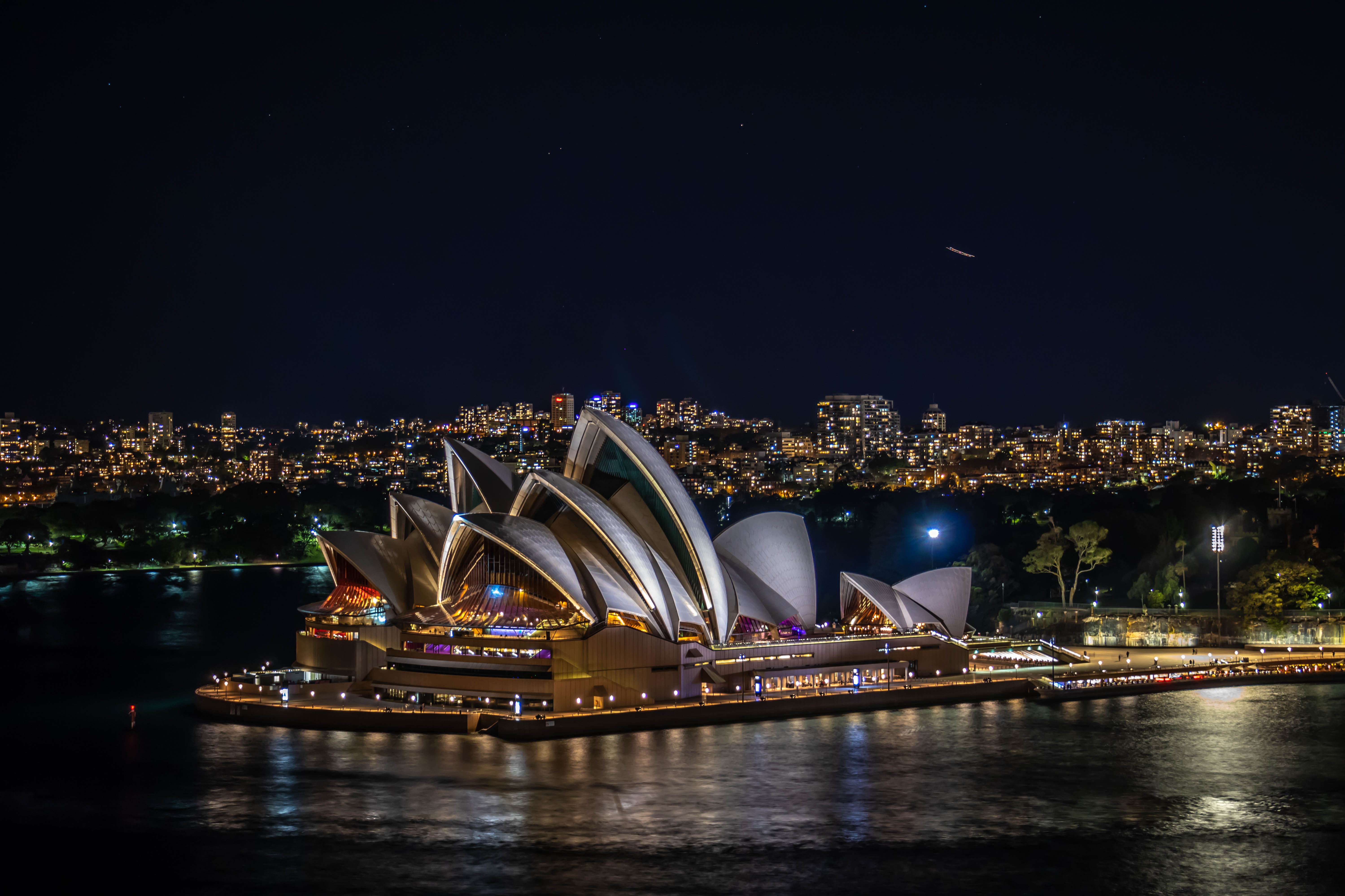 Explore the stunning Sydney Harbour at night with illuminated landmarks creating a breathtaking backdrop. Capture unforgettable memories as you discover iconic sites tailored to your adventure.
