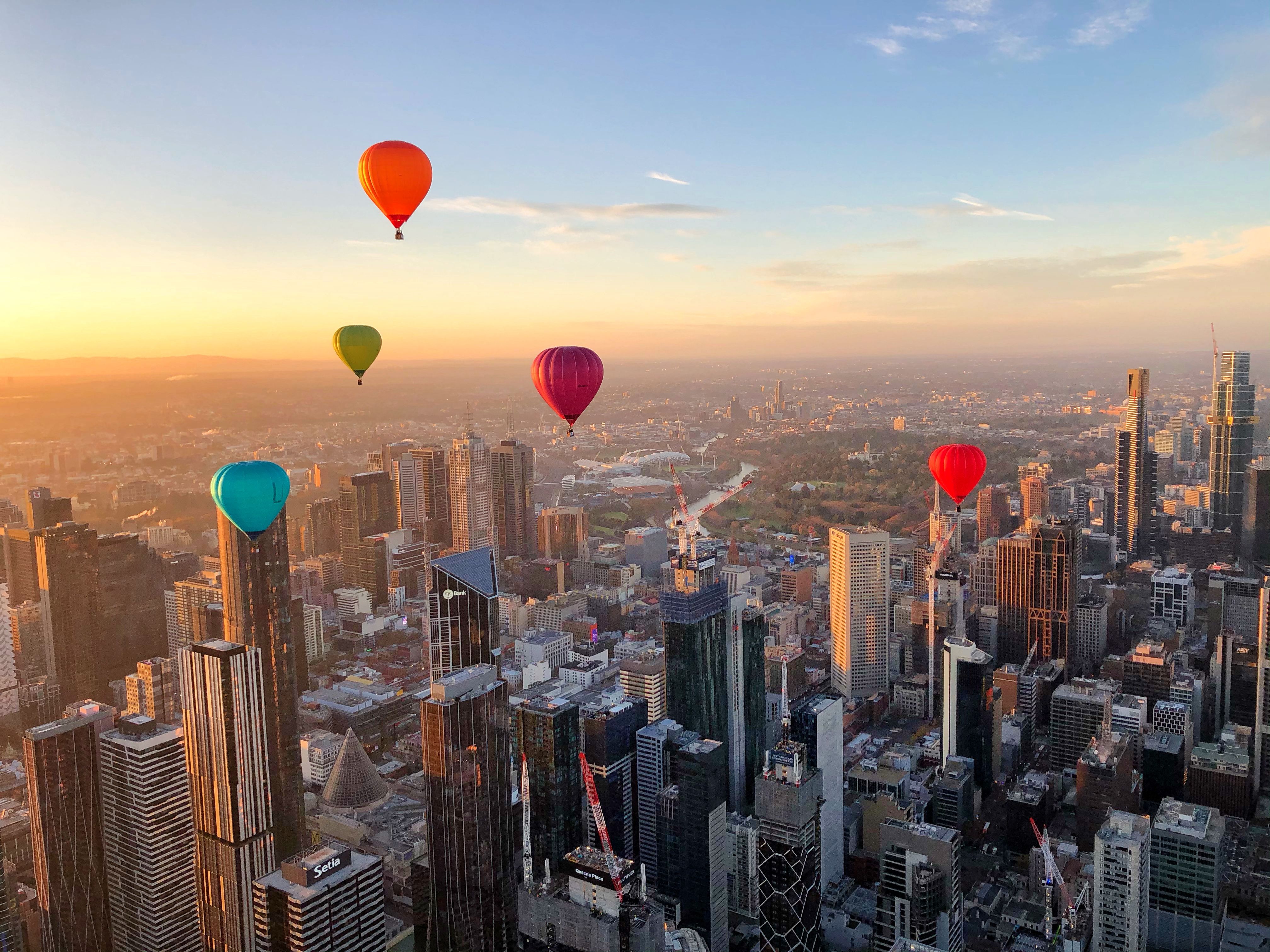 Float above Melbourne as hot air balloons drift over iconic skyscrapers offering an unforgettable view of the waking city and the serene Yarra River below. Embrace the moment with every sunrise.