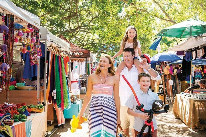 Explore the lively atmosphere of Eumundi Markets where families discover unique crafts and local delights creating unforgettable memories amidst a bustling scene filled with color and creativity.