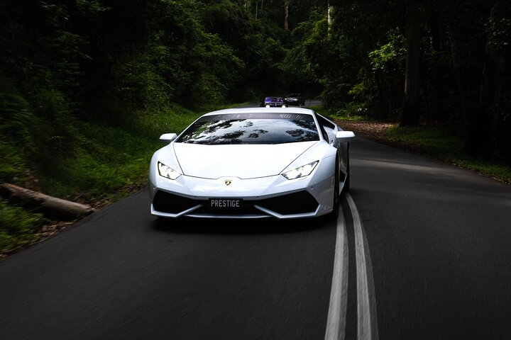 Experience the thrill of navigating lush rainforests and winding roads in the iconic Lamborghini Huracan creating unforgettable memories on the stunning Mornington Peninsula.