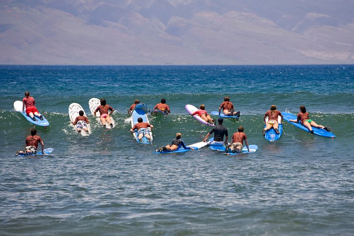 Experience the joy of catching waves along Melbourne's stunning coastline where beginners and enthusiasts gather for unforgettable surf lessons and the beauty of nature unfolds.