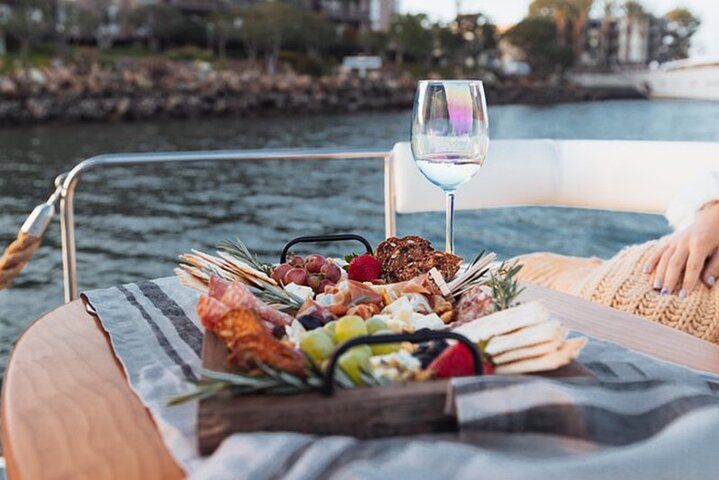 Indulge in a delicious spread while soaking in breathtaking views of Sydney's waterways creating unforgettable memories during your exploration of this iconic city.