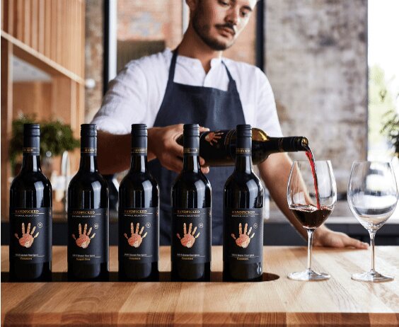 Experience the art of wine tasting in Sydney as expert hands pour exquisite varietals perfectly paired with delightful cheese and charcuterie creating a memorable culinary journey.
