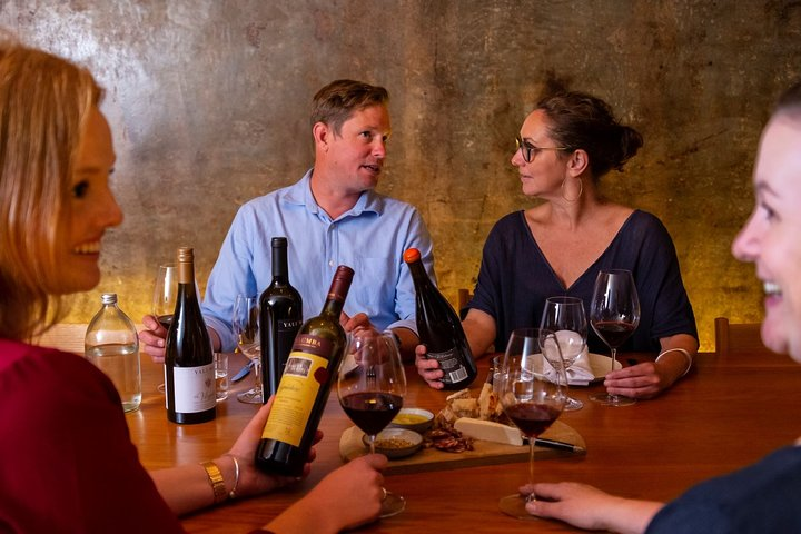 Savor the rich history of Yalumba wines while enjoying delightful conversations and exquisite tastings in an inviting space perfect for wine enthusiasts exploring Barossa Valley treasures.