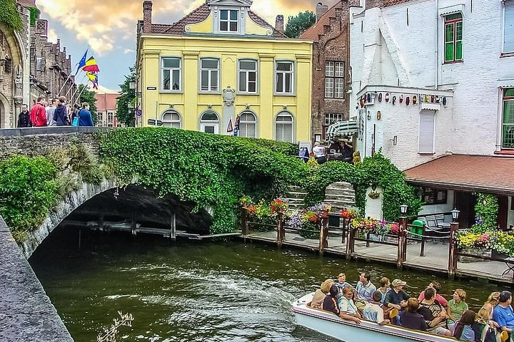 Explore the charm of Bruges as you stroll along picturesque canals historic bridges and stunning architecture immersing yourself in the city's rich medieval history and local culture.