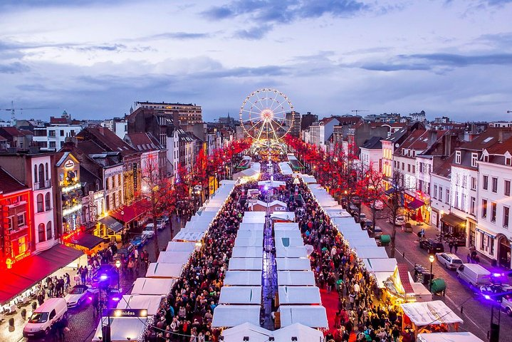 Explore the charm of Brussels' Christmas market featuring festive stalls twinkling lights and the delightful scent of seasonal treats all nestled in the heart of the city.