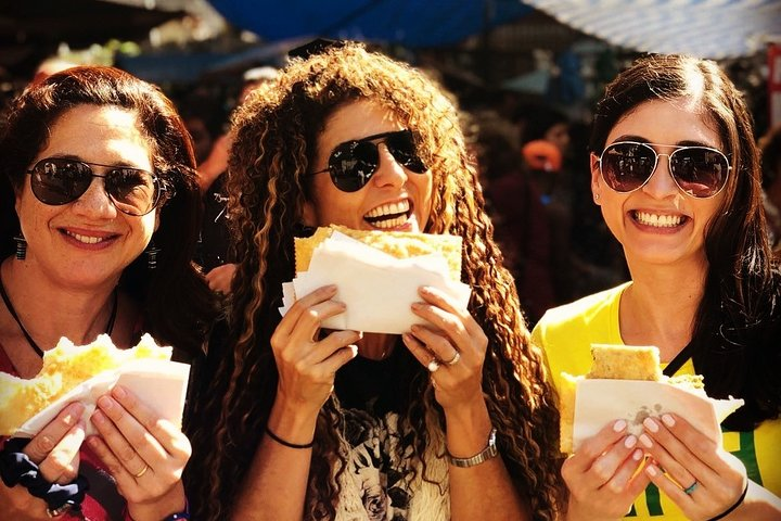 Enjoying a Pastel at the Farmers Market in Copacabana, Rio de Janeiro 