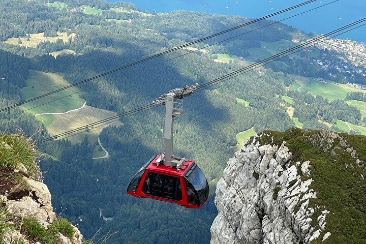 Soar above stunning landscapes on the Swiss Golden Pass Line Tour witnessing the beauty of the Alps and exploring serene lakes all from the comfort of a scenic cable car ride.