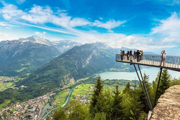 Experience breathtaking views from stunning heights where majestic mountains and serene lakes create a perfect backdrop for unforgettable memories in Switzerland's captivating landscapes.
