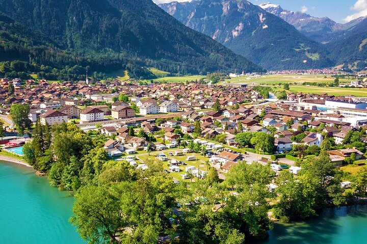 Experience the charm of Interlaken nestled between stunning lakes and majestic mountains perfect for leisurely walks exploring quaint villages and savoring delightful Swiss cuisine amidst breathtaking scenery.