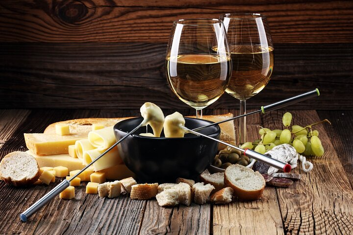 Savor the exquisite combination of fine Swiss cheese and wine perfect for indulging during leisurely moments in the heart of Switzerland's picturesque landscapes. Unforgettable flavors await.