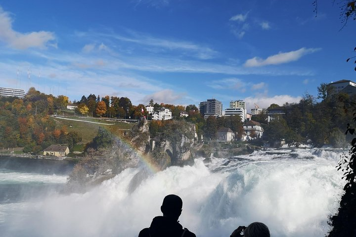 Experience the powerful rush of the Rhine Falls where water cascades dramatically creating a mesmerizing scene and a perfect backdrop for unforgettable memories in Switzerland.