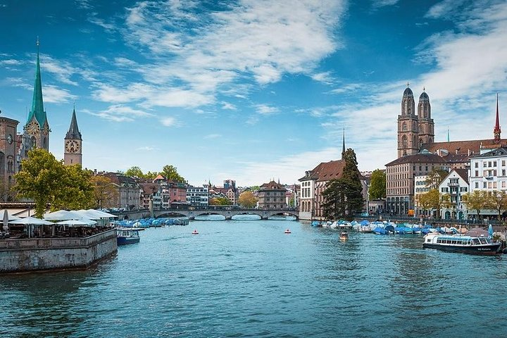 Discover Zurich's charming waterways historical architecture and stunning mountain views. Experience local culture through a unique blend of exploration on land water and air in just one day.