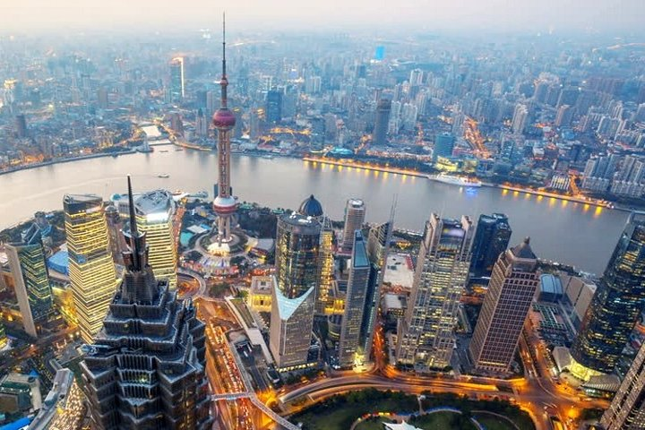 Experience the stunning skyline of Pudong where modern architecture meets artistic excellence. Marvel at the China Art Palace and capture sweeping views from Shanghai Tower's observation deck.