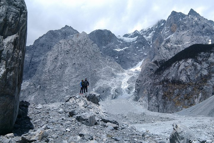 Directly below the 5,596 meter summit of Jade Dragon Snow Mountain, near the upper end of the glacial moraine.