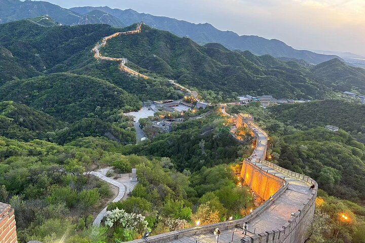 Experience the Badaling Great Wall illuminated under the night sky where historic watchtowers and scenic views blend seamlessly creating an extraordinary journey through time and beauty.